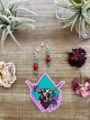 Green turquoise dangle earrings with red corral